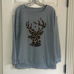 Deer size small top. Tag has been removed. Used but good condition